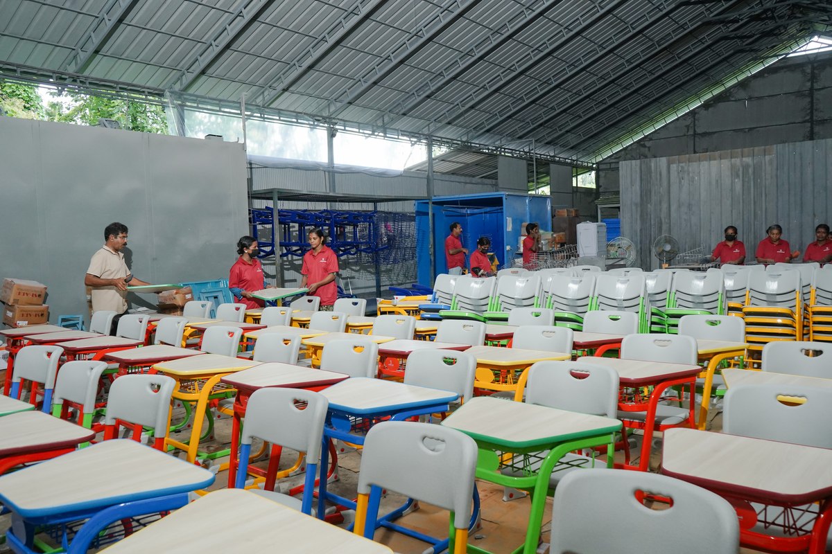 STEELwud staff assembling classroom furniture