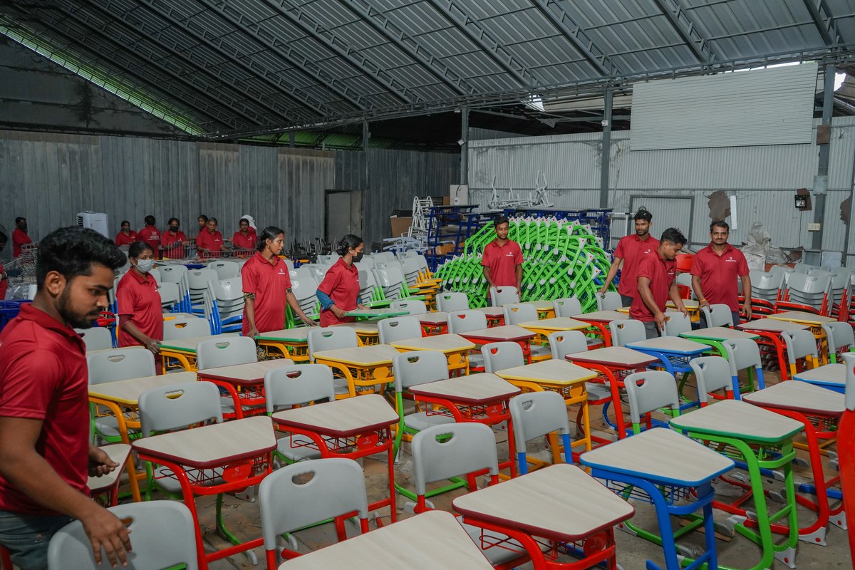 STEELwud staff working on a batch of classroom desks