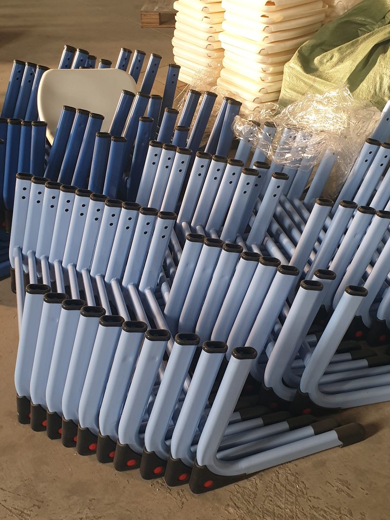 Cantilever chair frames stacked before assembly