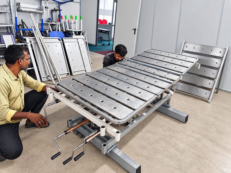 Hospital bed frame being checked before finishing