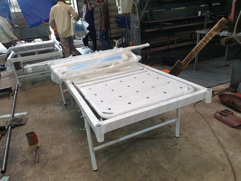 Hospital bed frame being fitted on the shop floor