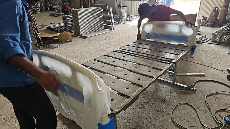 Hospital bed frames being assembled