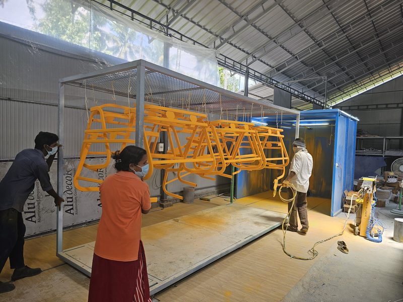 Chair frames in the powder-coating booth