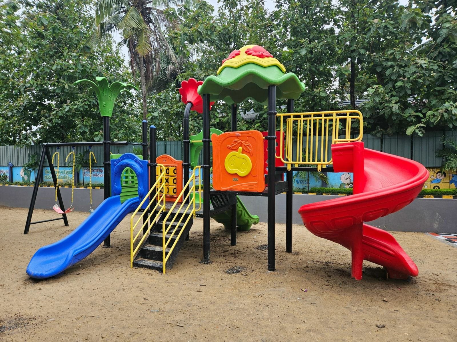 Multi-play system with spiral slide, wave slide and swing set