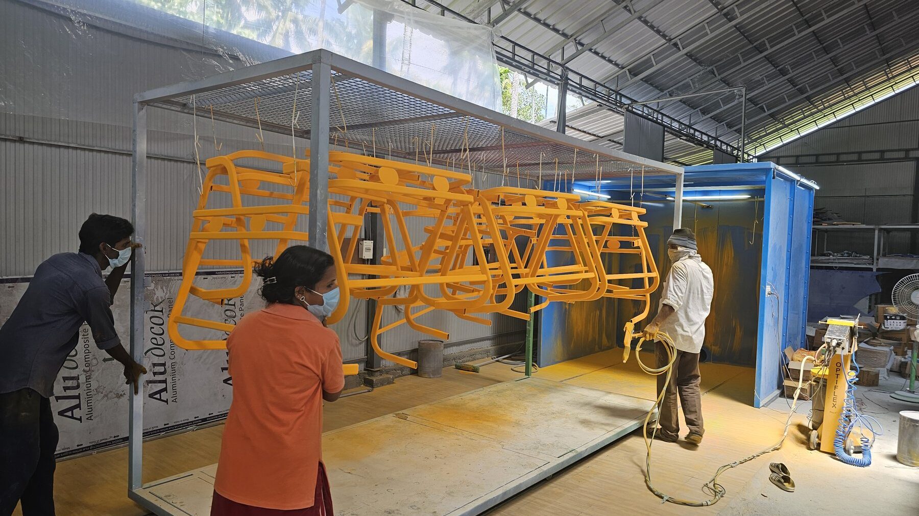 Chair frames being powder coated on the STEELwud shop floor